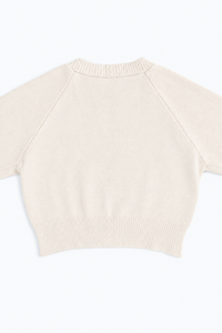 The Suss Knits Cream Open Raglan Knit Top detail shot of back panel with ribbed hem knit in cotton and lycra