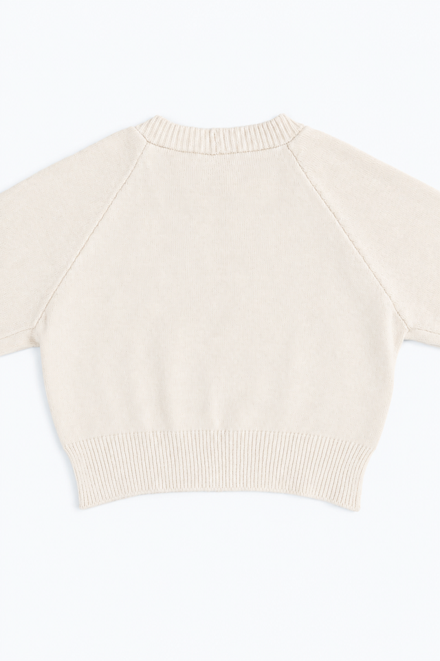 The Suss Knits Cream Open Raglan Knit Top detail shot of back panel with ribbed hem knit in cotton and lycra