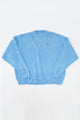 Oversized blue knit sweater flatlay by Suss Knits with wide fit and distressed ribbed hem