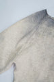 Close up of raglan sleeve finish full fashioned on the archive finish cotton sweater knit in Los Angeles.
