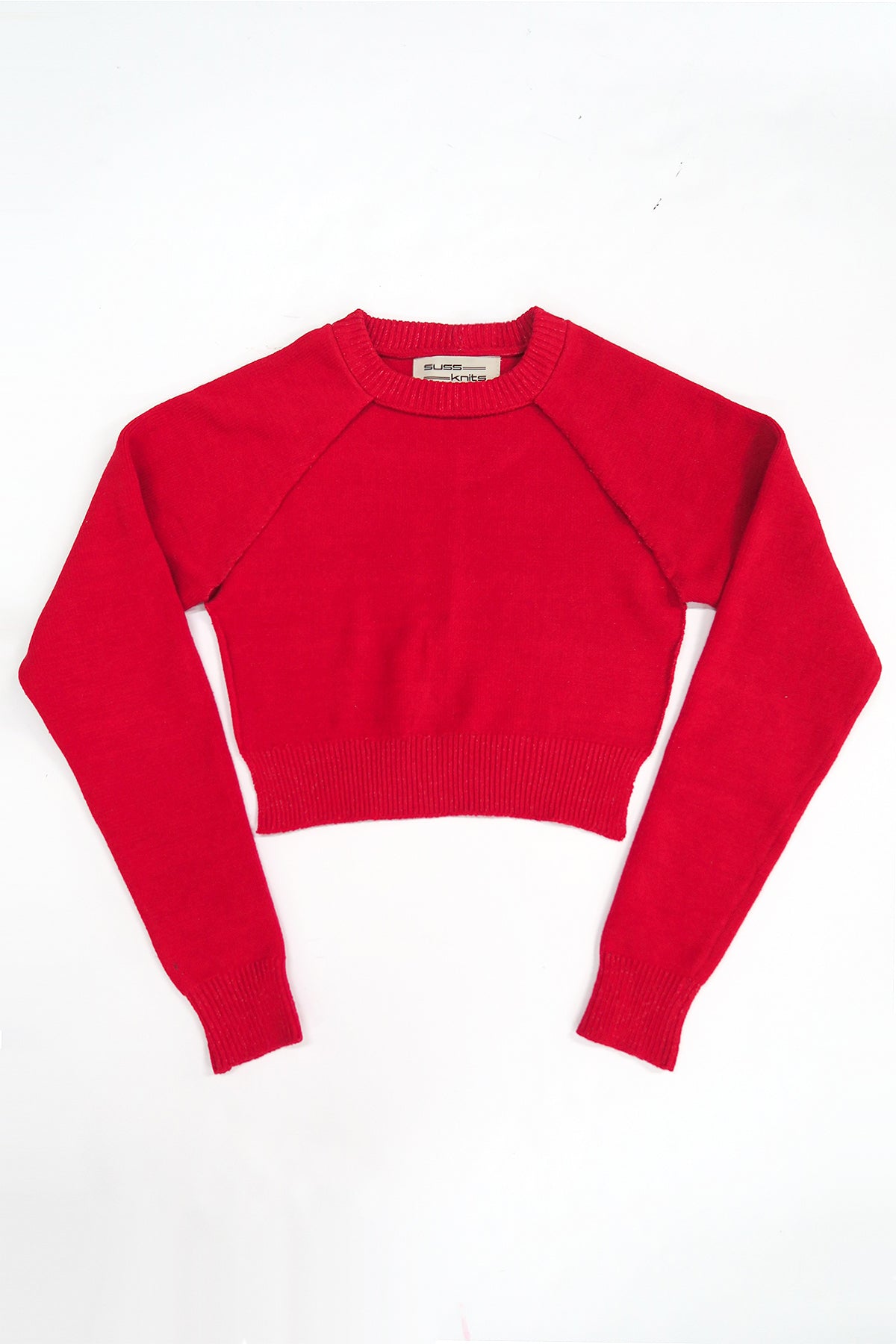 The Suss knits bright Red Open Raglan Knit Top in recycled cotton and lycra, front flat lay, knit in Los Angeles.