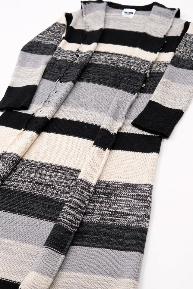 Lightweight striped duster cardigan draped flat at an angle showing long silhouette and fluid open front design