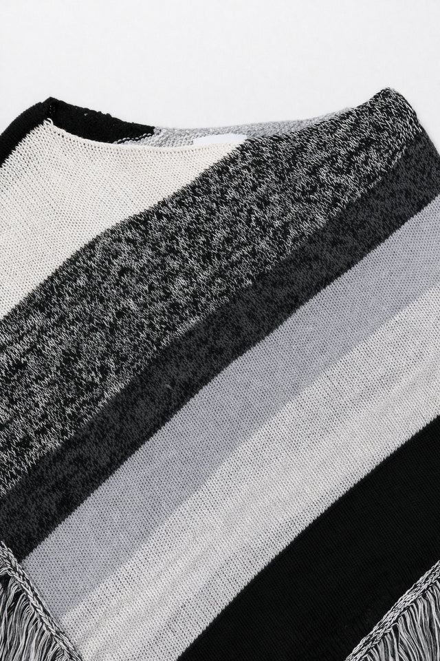 Close-up of neckline on black and grey, cotton, striped knit poncho showing texture