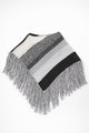 Black and grey striped knit cotton poncho with fringe laid flat on light grey background