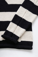 Striped sleeve detail on distressed knit sweater by Suss Knits