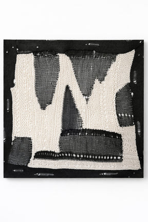 Large abstract textile wall art in black and cream, hand loomed knit and mesh composition with varied yarn textures and dimensional stitching, made in Los Angeles by Suss Knits