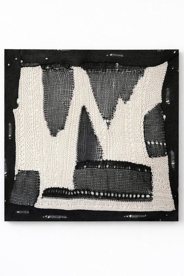 Large abstract textile wall art in black and cream, hand loomed knit and mesh composition with varied yarn textures and dimensional stitching, made in Los Angeles by Suss Knits