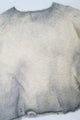 Front angle view of the archive finish raglan sweater hand loomed in slub cotton and finished with distressing and hand dye techniques.