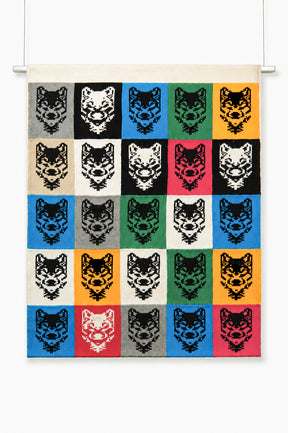 Hand-loomed wolf grid knit wall hanging made of cotton panels with steel hanging rod, 50 by 40 inches