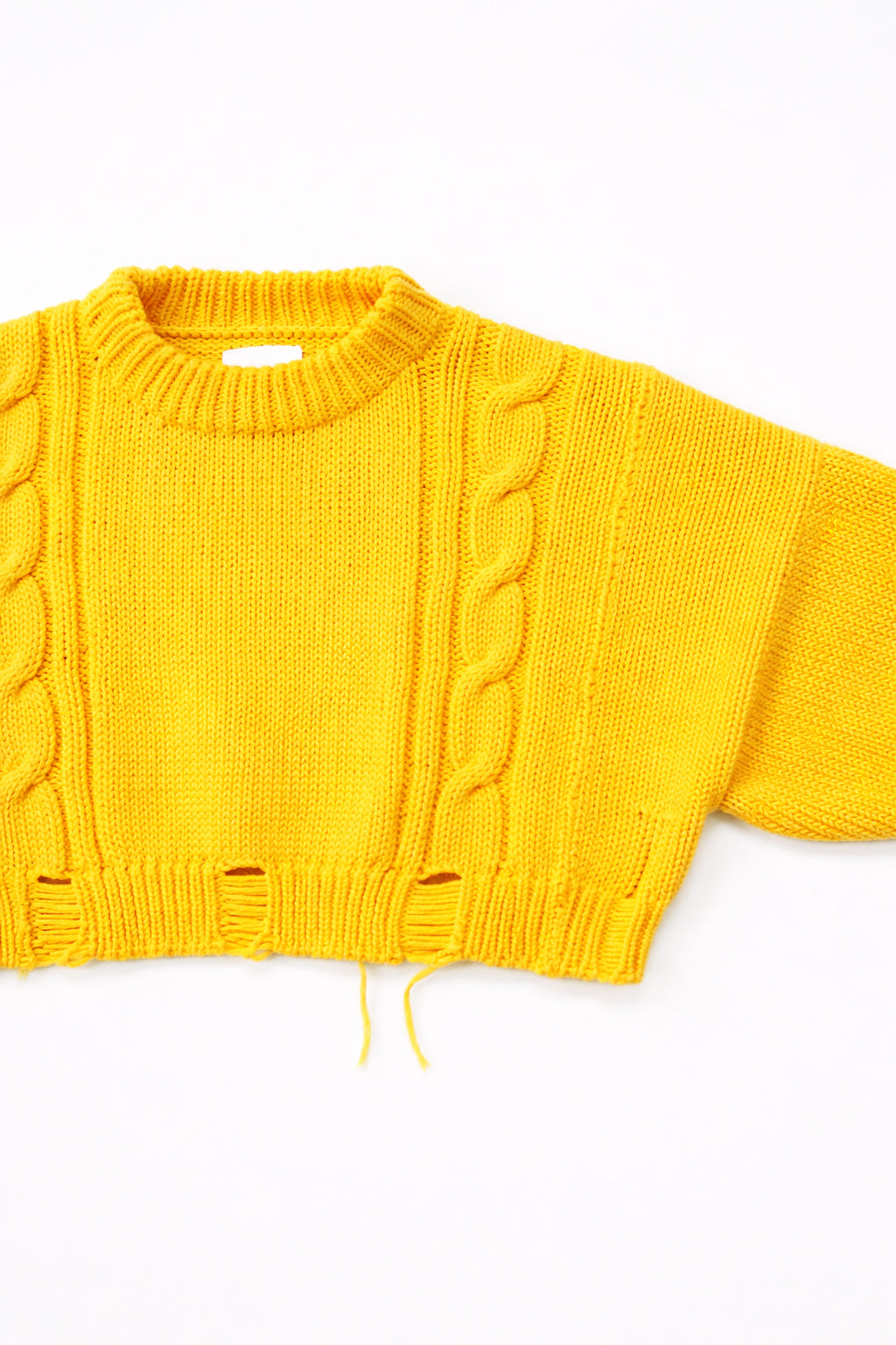Side detail of the cropped cable yellow crewneck sweater knit in Los Angeles