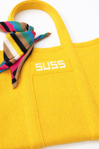 Close up of yellow knit tote with multistripe scarf detail, textured knit cotton by Suss Knits