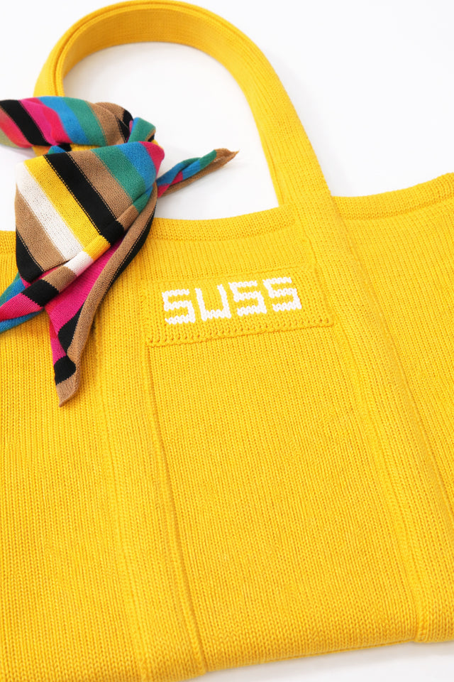 Close up of yellow knit tote with multistripe scarf detail, textured knit cotton by Suss Knits