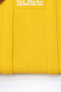 Close up of yellow knit tote bag texture and stitching detail in recycled cotton by Suss Knits