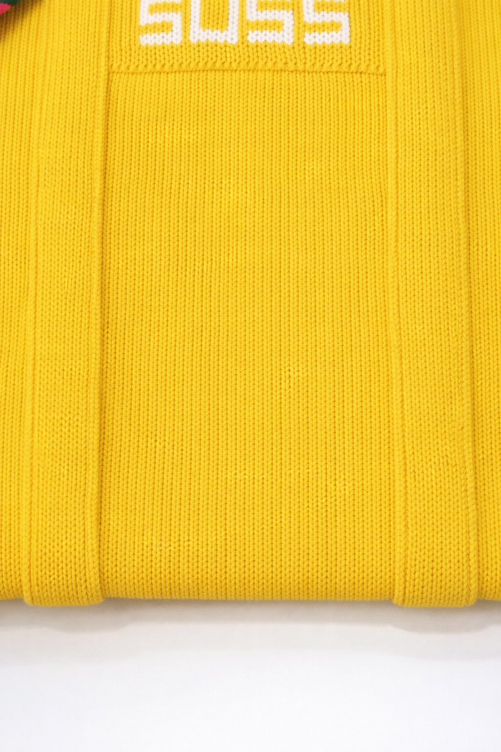 Close up of yellow knit tote bag texture and stitching detail in recycled cotton by Suss Knits