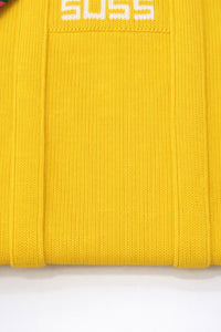 Close up of yellow knit tote bag texture and stitching detail in recycled cotton by Suss Knits
