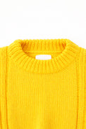 Close up detail of the knit ribbed crewneck in a yellow cotton wool blend