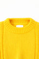 Close up detail of the knit ribbed crewneck in a yellow cotton wool blend
