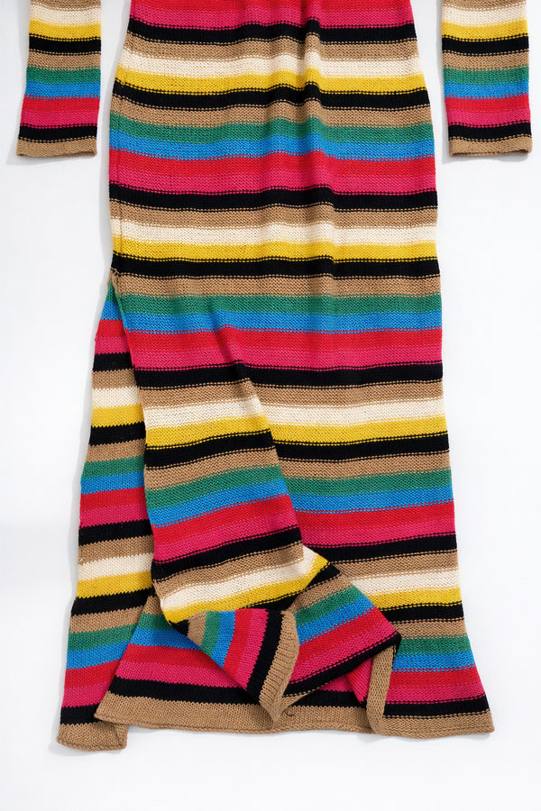 Lower portion of striped knit dress showing fabric drape and long length silhouette
