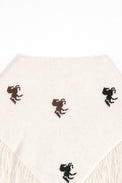 cream knit poncho back view with horse motif and fringe