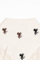 cream knit poncho back view with horse motif and fringe