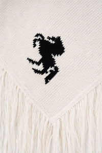 horse motif detail on cream knit poncho close up